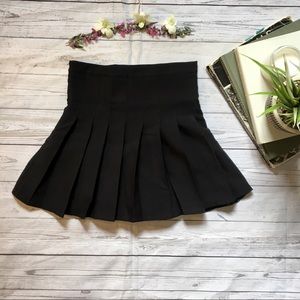Pleated black mini skirt